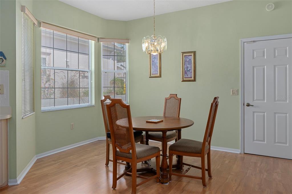 3529 South Belgrave Drive Inverness, FL 34452 - Photo 11 of 35 a view of a dining room with furniture and a chandelier