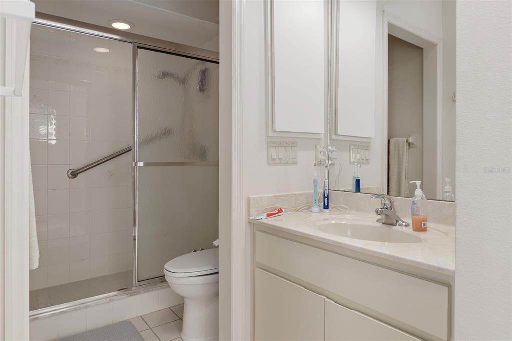 3529 South Belgrave Drive Inverness, FL 34452 - Photo 14 of 35 a bathroom with a toilet sink vanity and shower