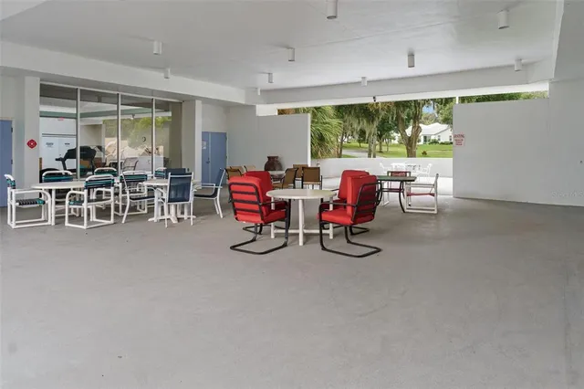a view of a big room with furniture window and outside view