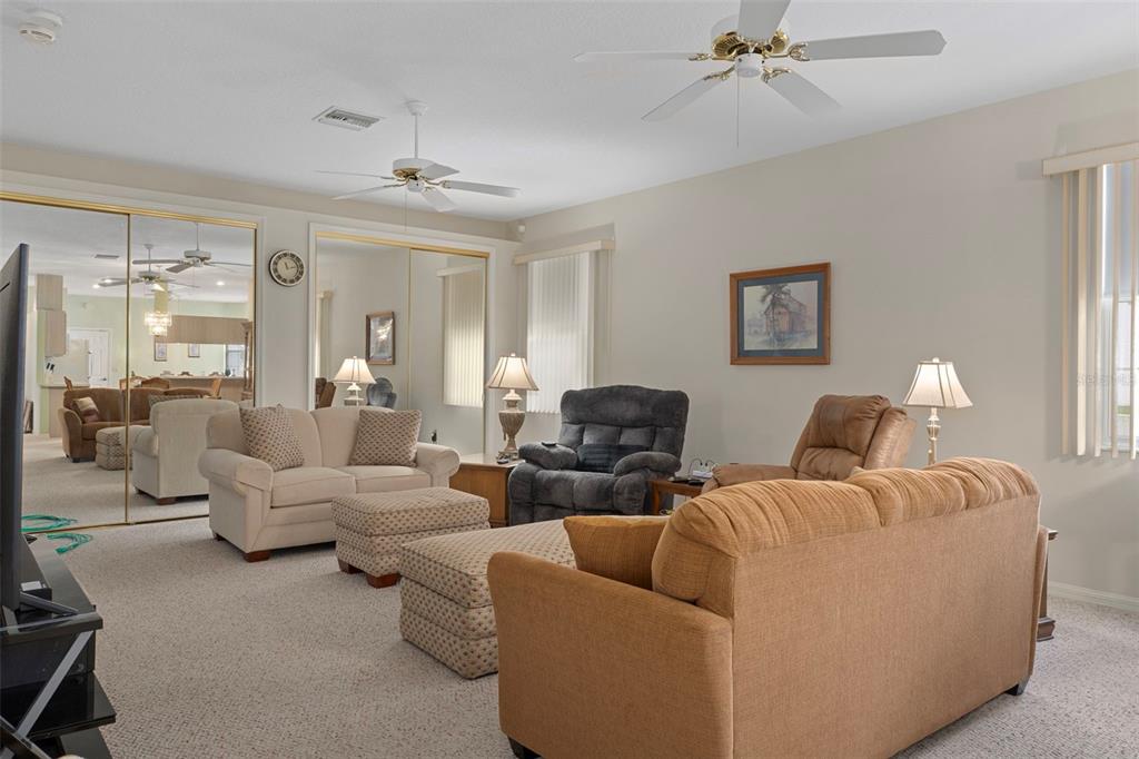 3529 South Belgrave Drive Inverness, FL 34452 - Photo 4 of 35 a living room with furniture and a chandelier