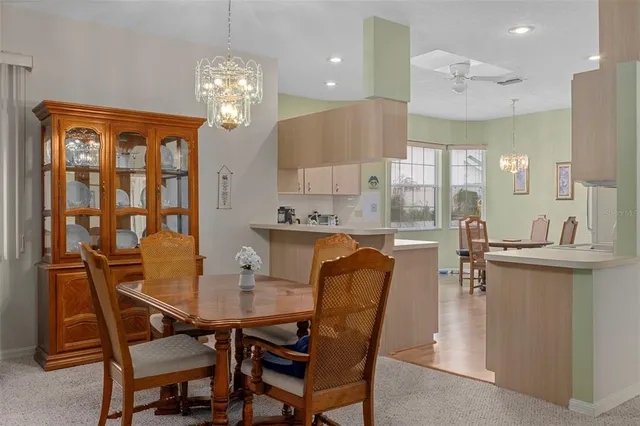 a dining room with furniture and window