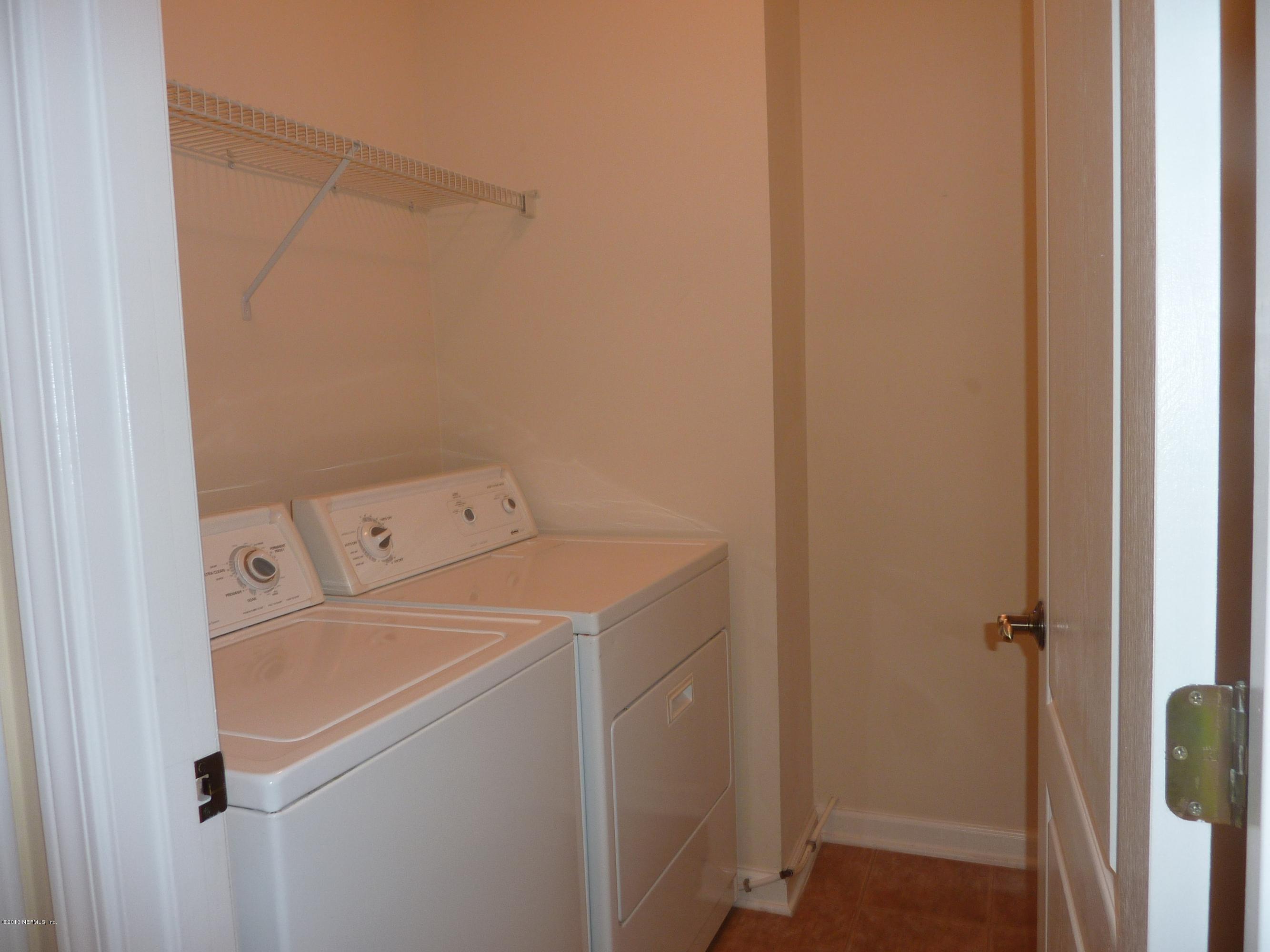 273 Porta Rosa Circle St. Augustine, FL 32092 - Photo 12 of 48 a utility room with dryer and washer