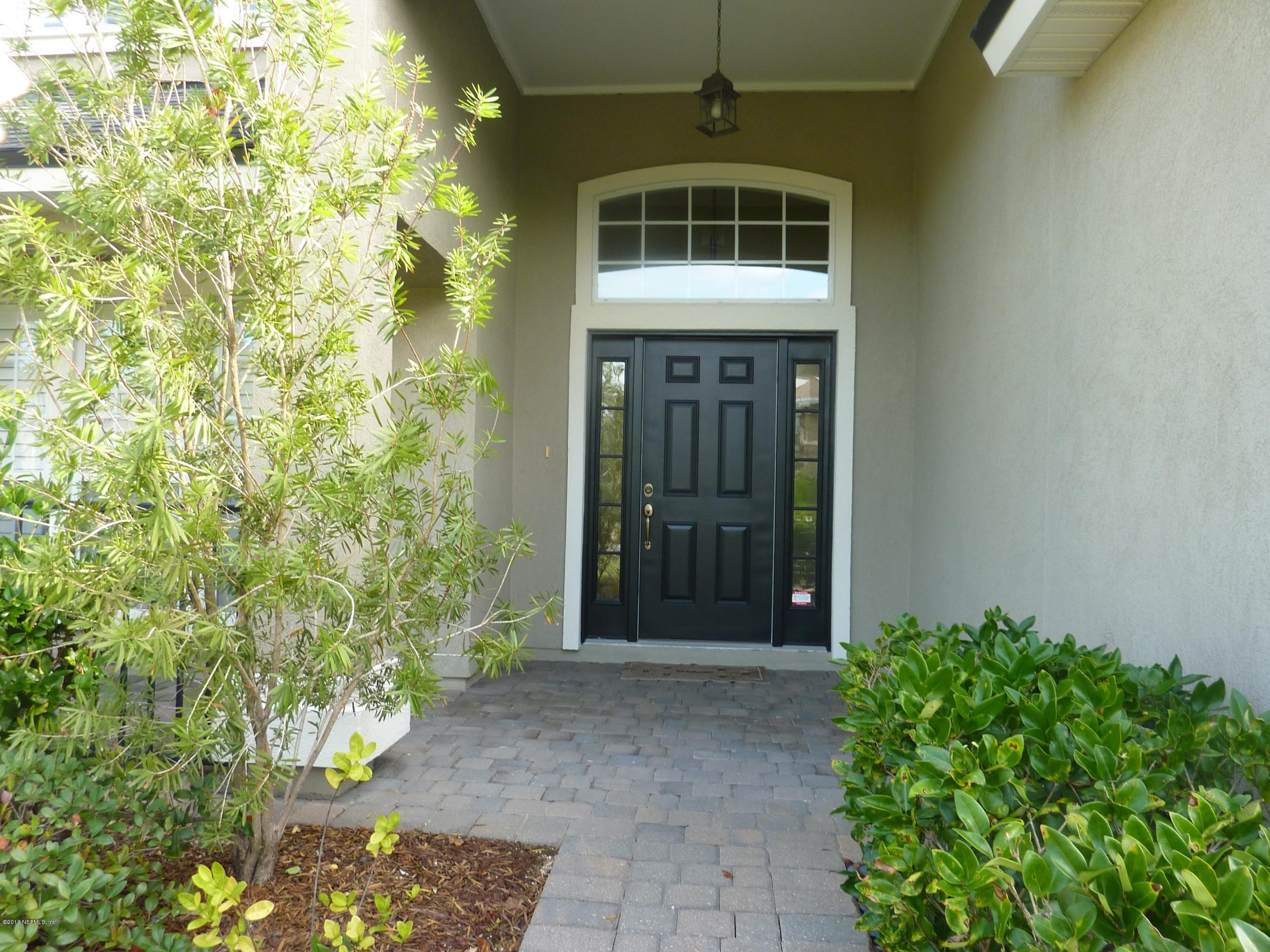 273 Porta Rosa Circle St. Augustine, FL 32092 - Photo 2 of 48 a front view of a house with a yard