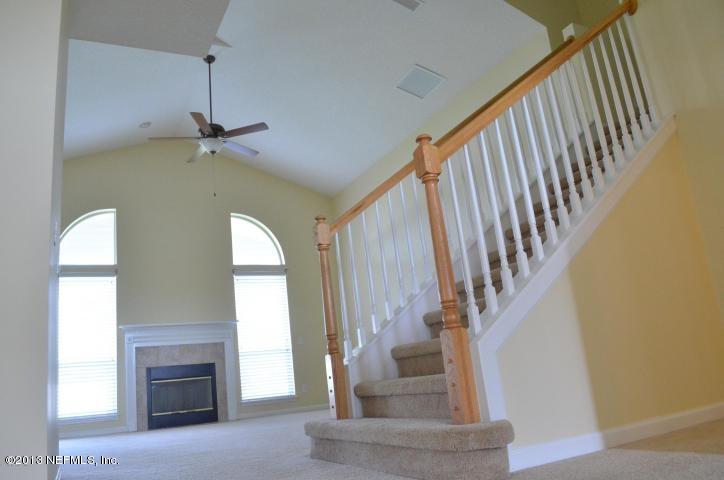 273 Porta Rosa Circle St. Augustine, FL 32092 - Photo 4 of 48 a view of staircase with fireplace and a window