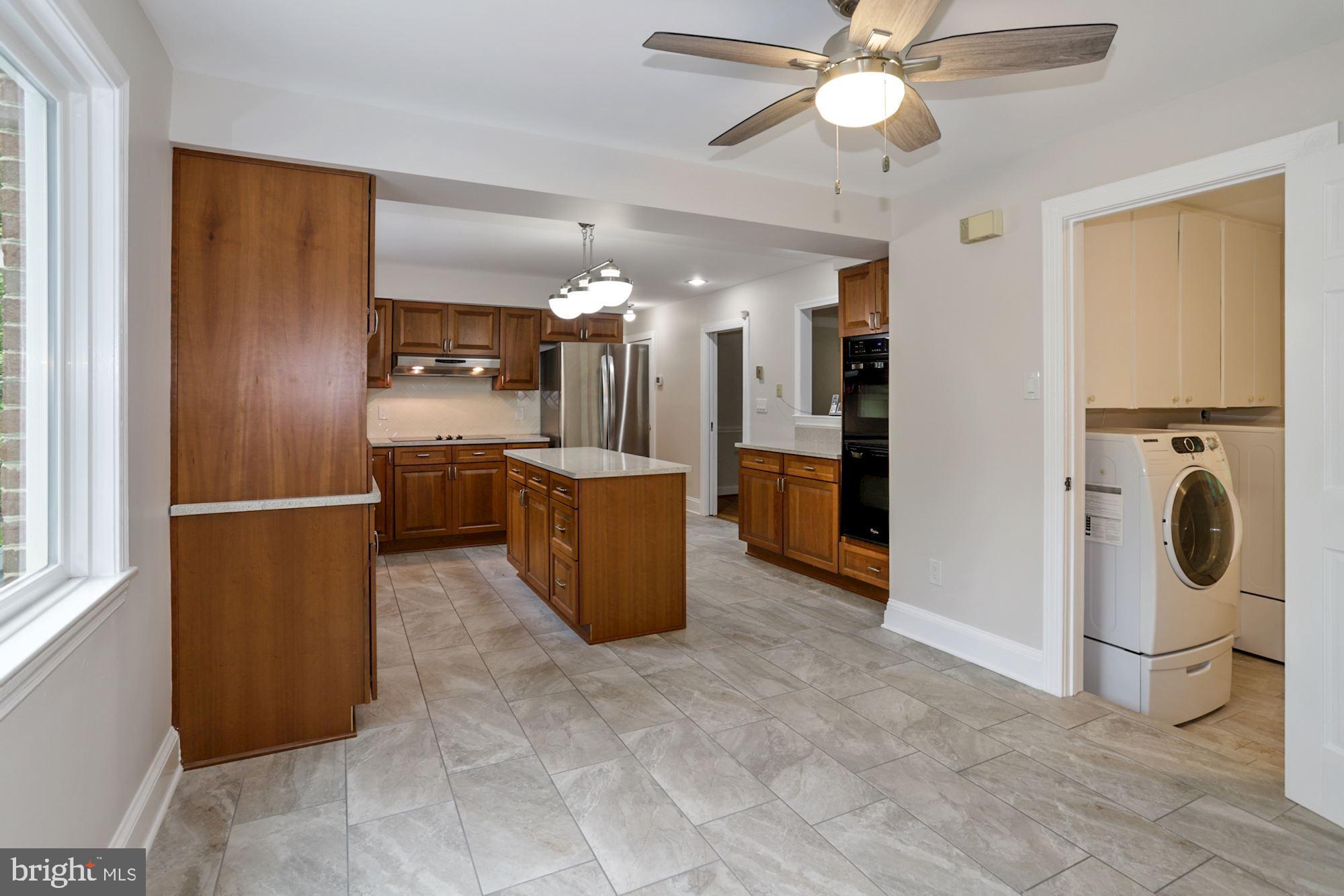301 Pine Road Fort Washington, MD 20744 - Photo 18 of 55 Kitchen with main level laundry room