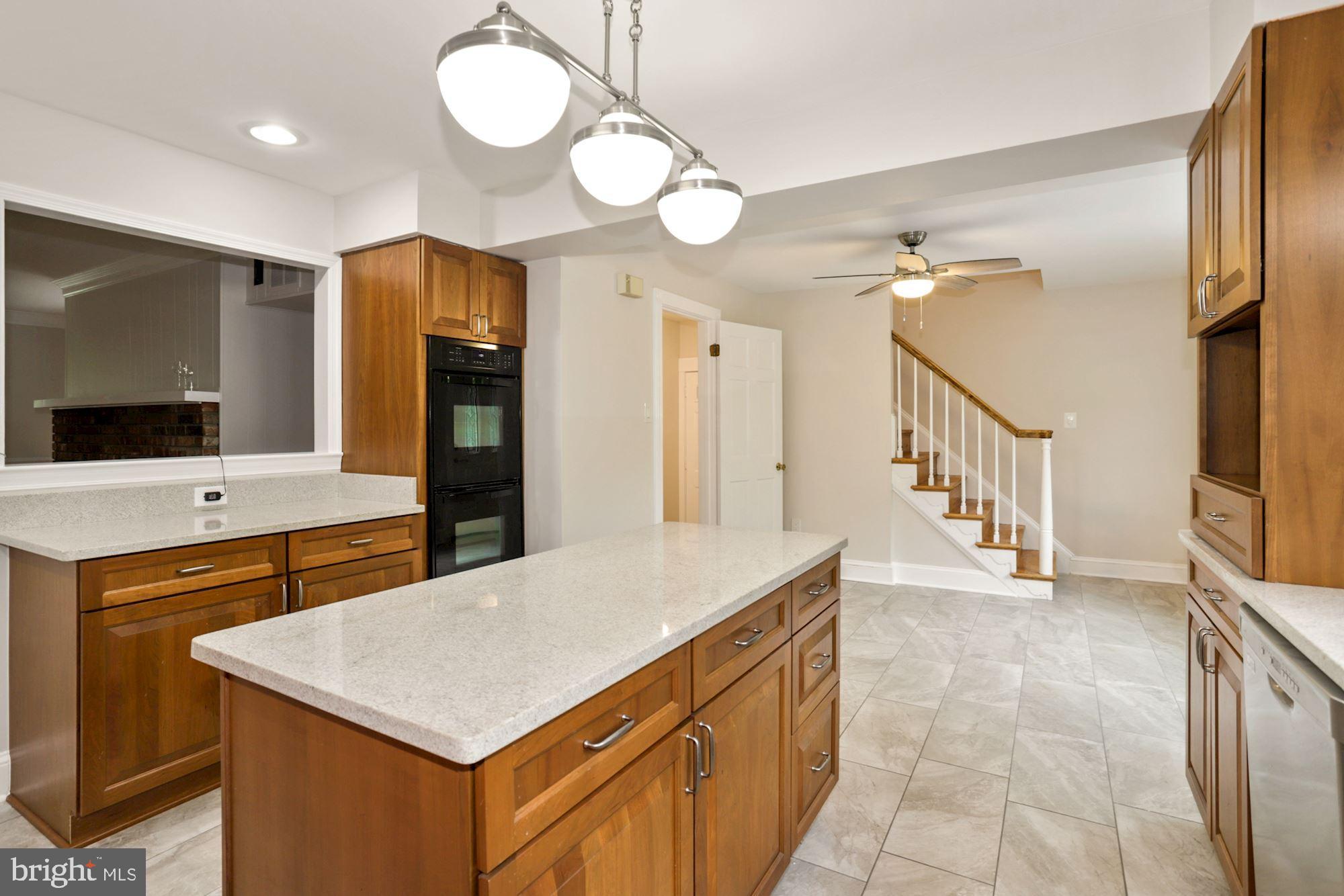 301 Pine Road Fort Washington, MD 20744 - Photo 19 of 55 Kitchen and 2nd staircase to upper level