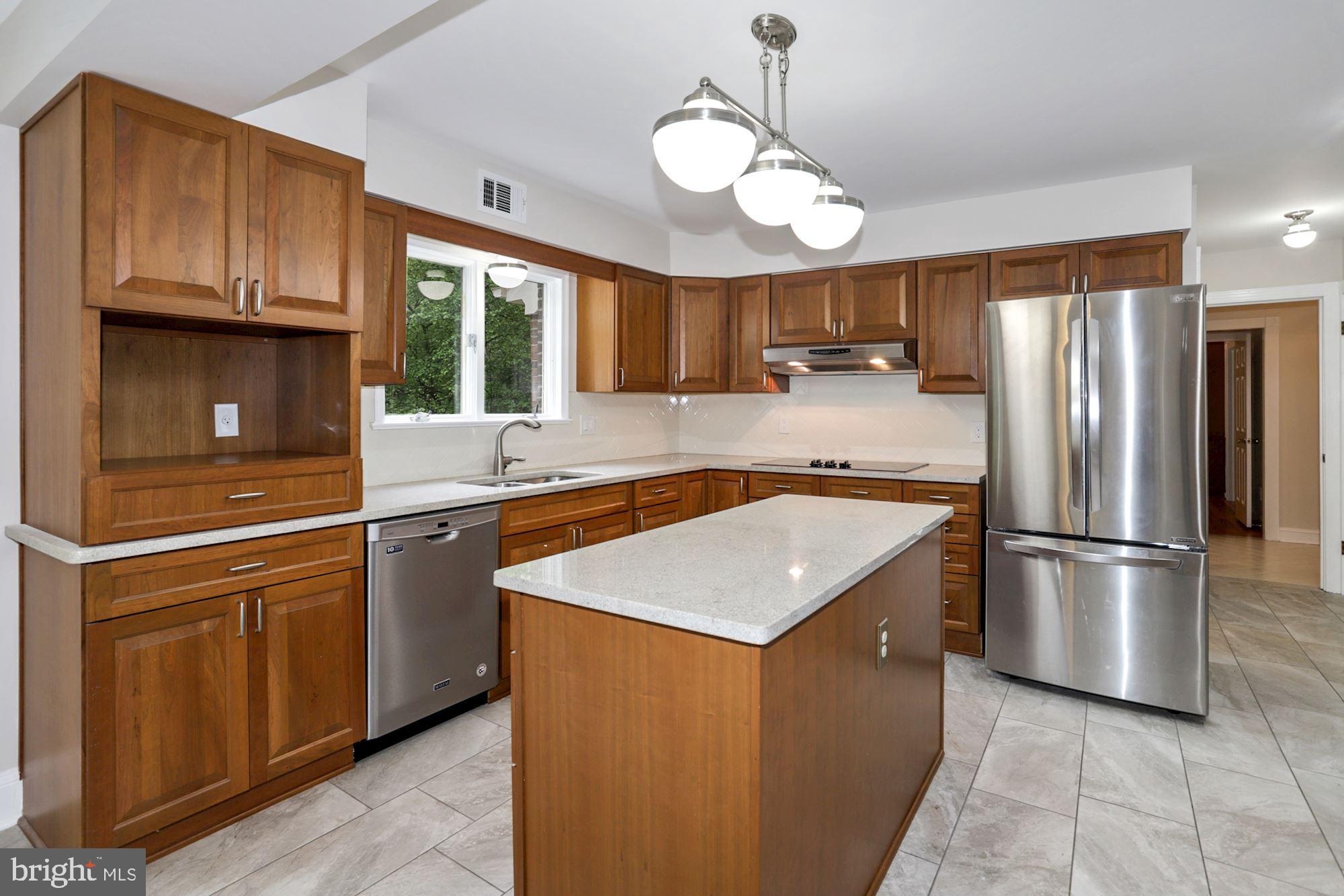 301 Pine Road Fort Washington, MD 20744 - Photo 20 of 55 Kitchen with view of garden and forest