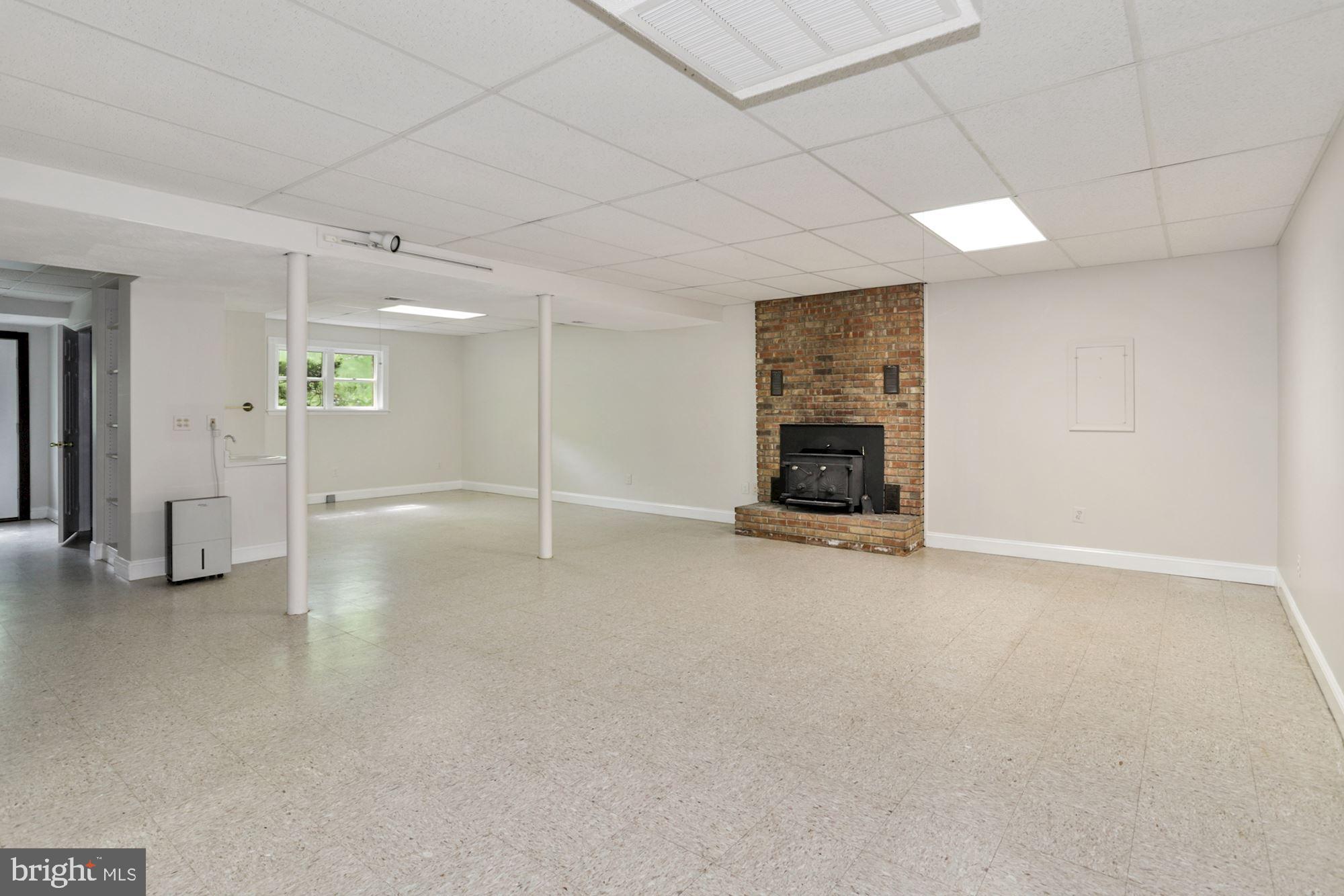 301 Pine Road Fort Washington, MD 20744 - Photo 43 of 55 Lower level recreation room with fireplace insert