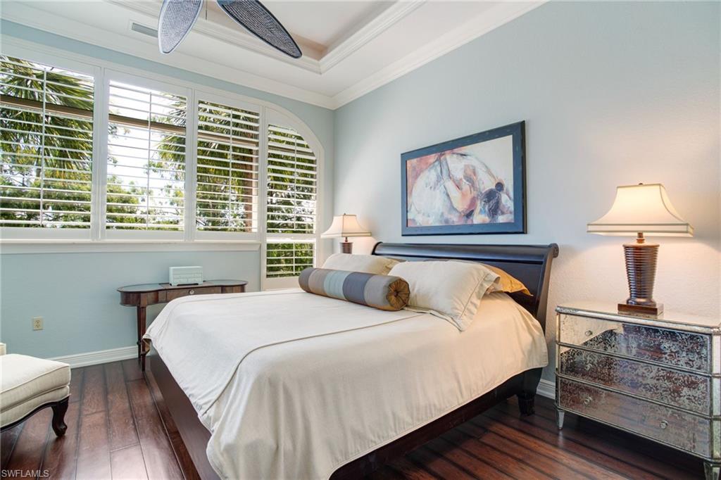 15547 Monterosso Lane, Unit 201 Naples, FL 34110 - Photo 17 of 50 a bedroom with bed and a window