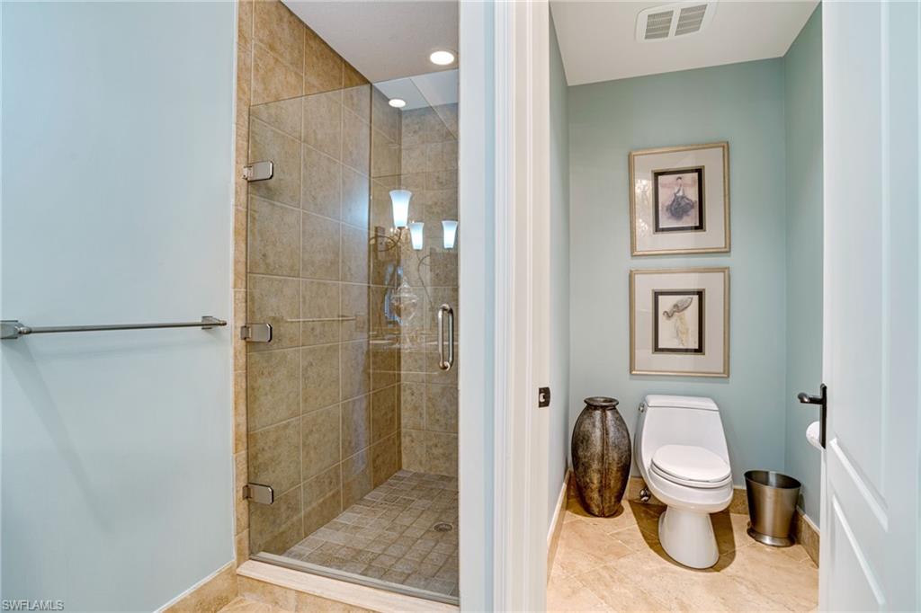 15547 Monterosso Lane, Unit 201 Naples, FL 34110 - Photo 19 of 50 a bathroom with a toilet and a shower