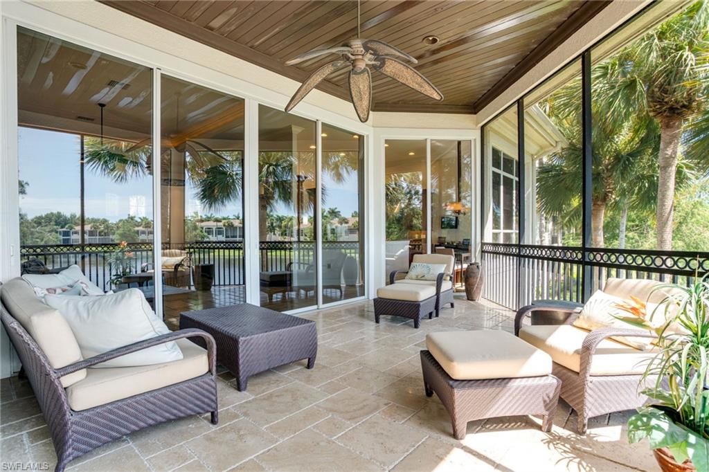 15547 Monterosso Lane, Unit 201 Naples, FL 34110 - Photo 26 of 50 a outdoor space with patio the couches and a dining table with garden view