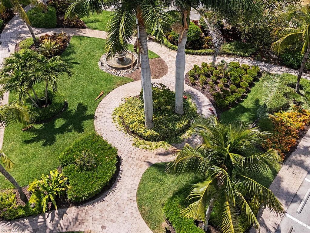 15547 Monterosso Lane, Unit 201 Naples, FL 34110 - Photo 31 of 50 a view of a garden with plants