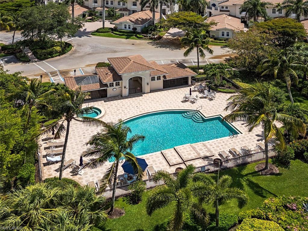 15547 Monterosso Lane, Unit 201 Naples, FL 34110 - Photo 33 of 50 a view of a house with a yard and sitting area