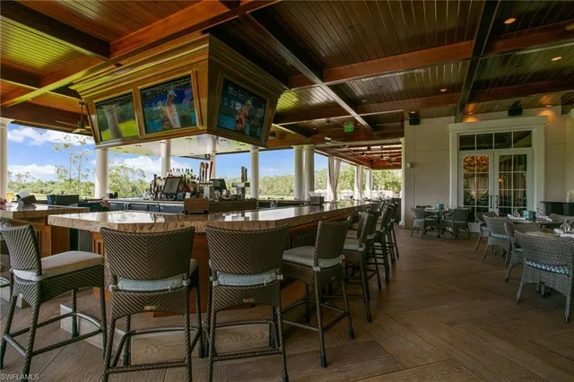 a view of dining table chairs and wooden floor