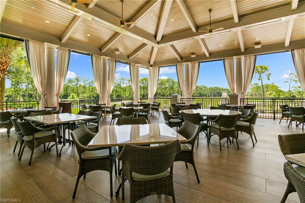 15547 Monterosso Lane, Unit 201 Naples, FL 34110 - Photo 41 of 50 a view of a dining room with furniture window and outside view