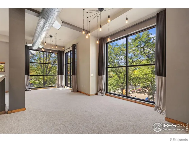 a view of an entryway with a floor to ceiling window
