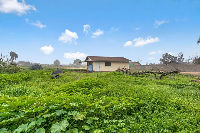 a view of a backyard with sitting area
