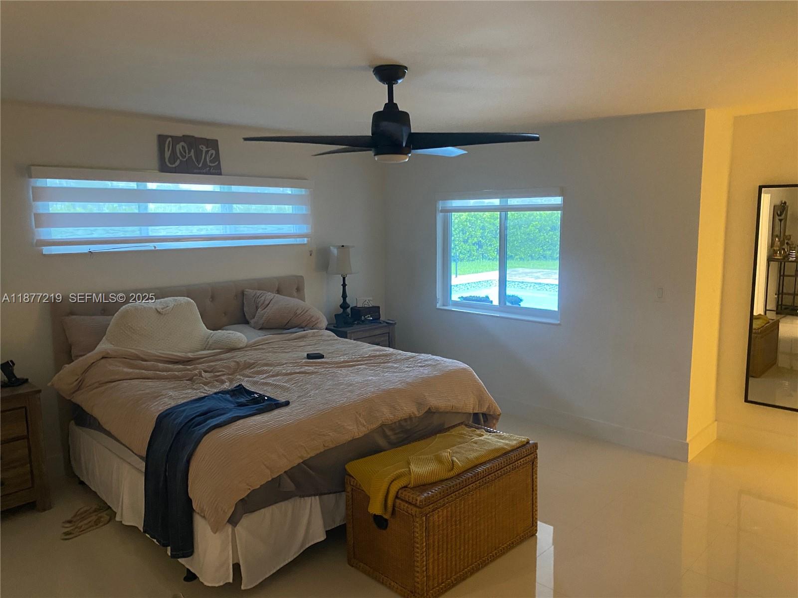 9203 Southwest 136th Terrace Miami, FL 33176 - Photo 11 of 22 a bedroom with bed and window