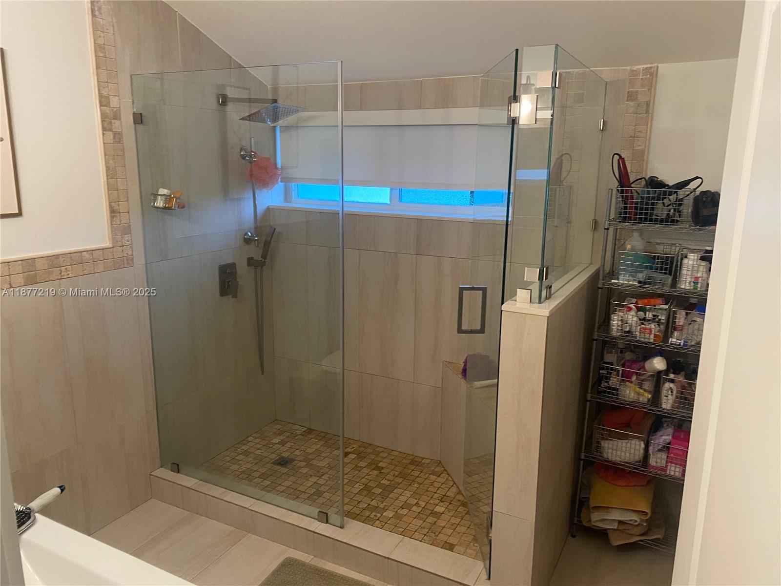 9203 Southwest 136th Terrace Miami, FL 33176 - Photo 12 of 22 a bathroom with a shower