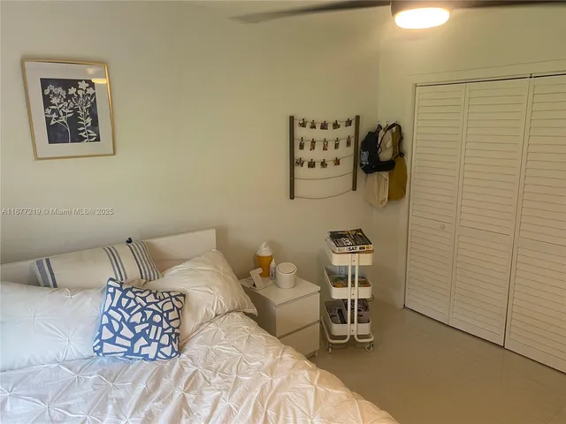 a bedroom with a bed and a chair