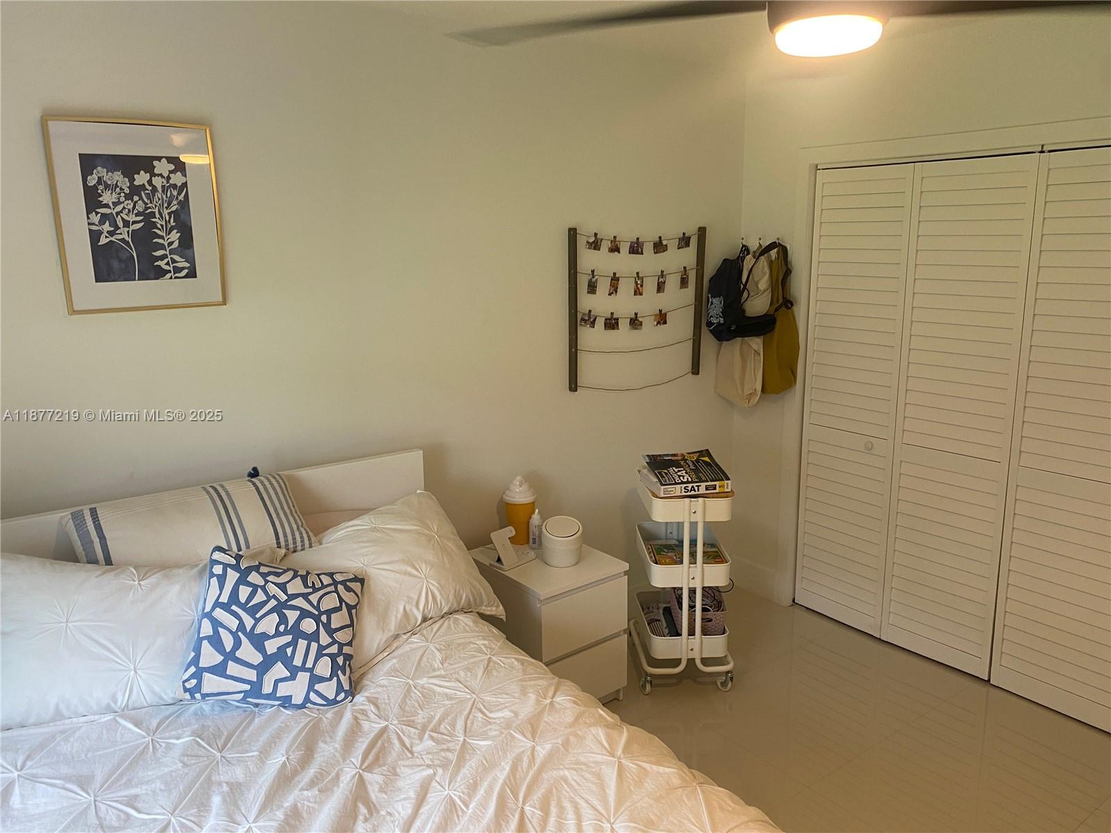 9203 Southwest 136th Terrace Miami, FL 33176 - Photo 14 of 22 a bedroom with a bed and a chair