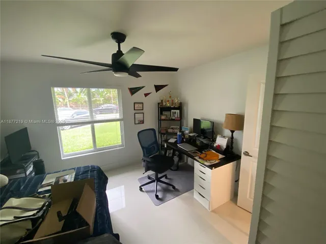 a work room with furniture and windows