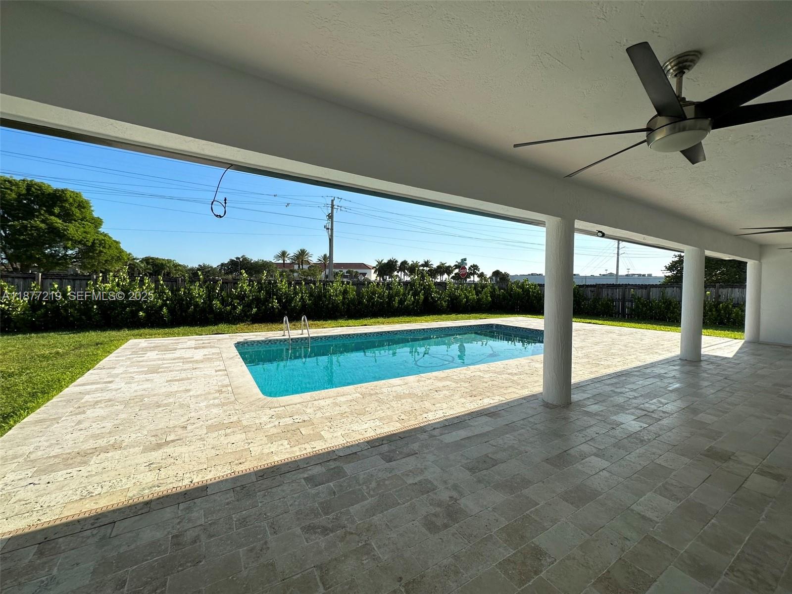 9203 Southwest 136th Terrace Miami, FL 33176 - Photo 18 of 22 a view of swimming pool with yard
