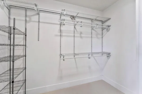 a bathroom with a sink toilet vanity and shower