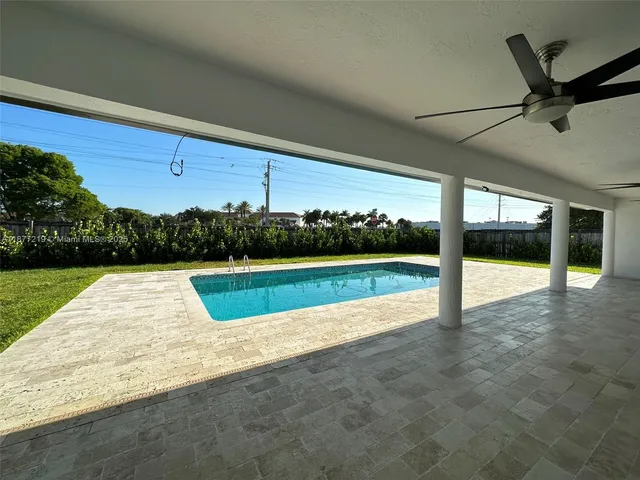 a view of swimming pool with yard