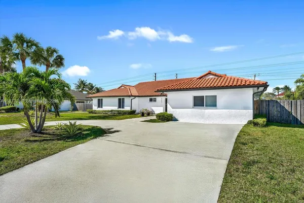 a front view of a house with yard