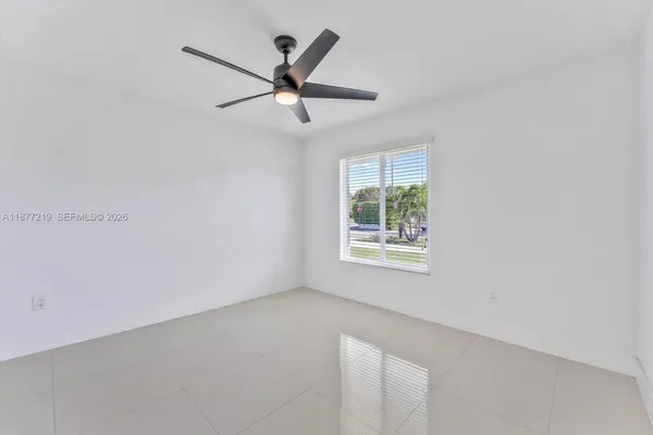 a bathroom with a sink shower and a toilet