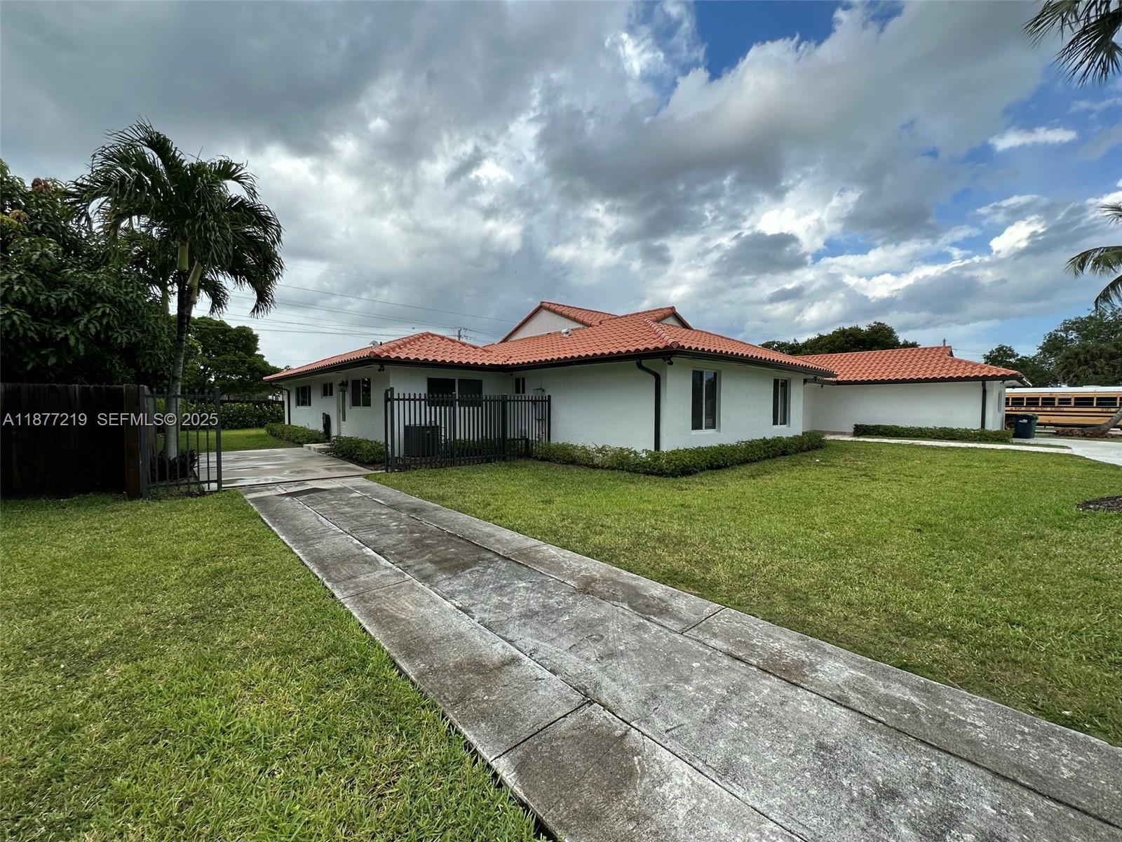 9203 Southwest 136th Terrace Miami, FL 33176 - Photo 22 of 22 a front view of house with yard and green space