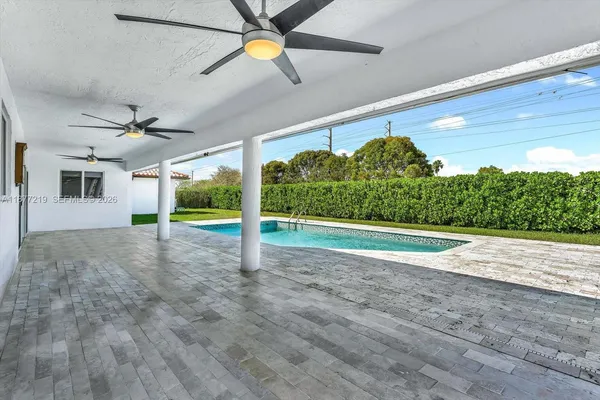 a kitchen with stainless steel appliances a refrigerator and a stove top oven