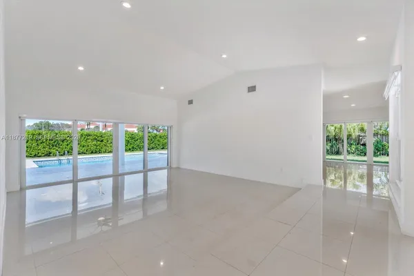 a view of an empty room with a sliding door