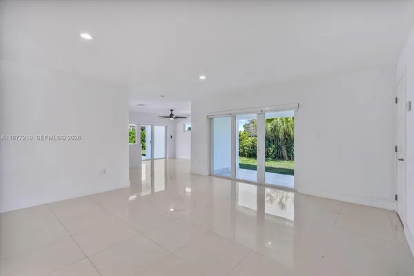 a kitchen with kitchen island a sink stainless steel appliances and cabinets