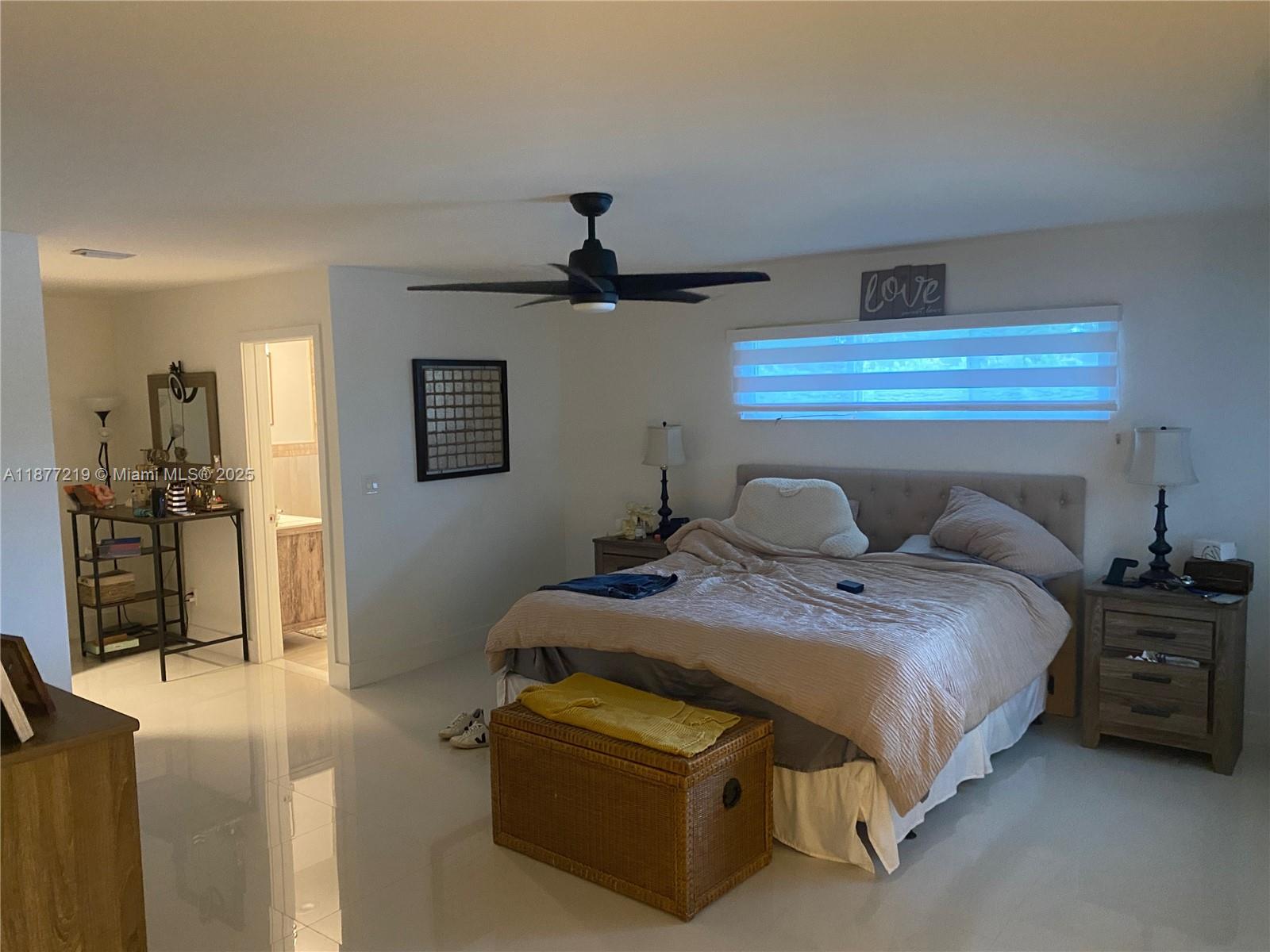 9203 Southwest 136th Terrace Miami, FL 33176 - Photo 10 of 22 a bedroom with a bed and a chandelier