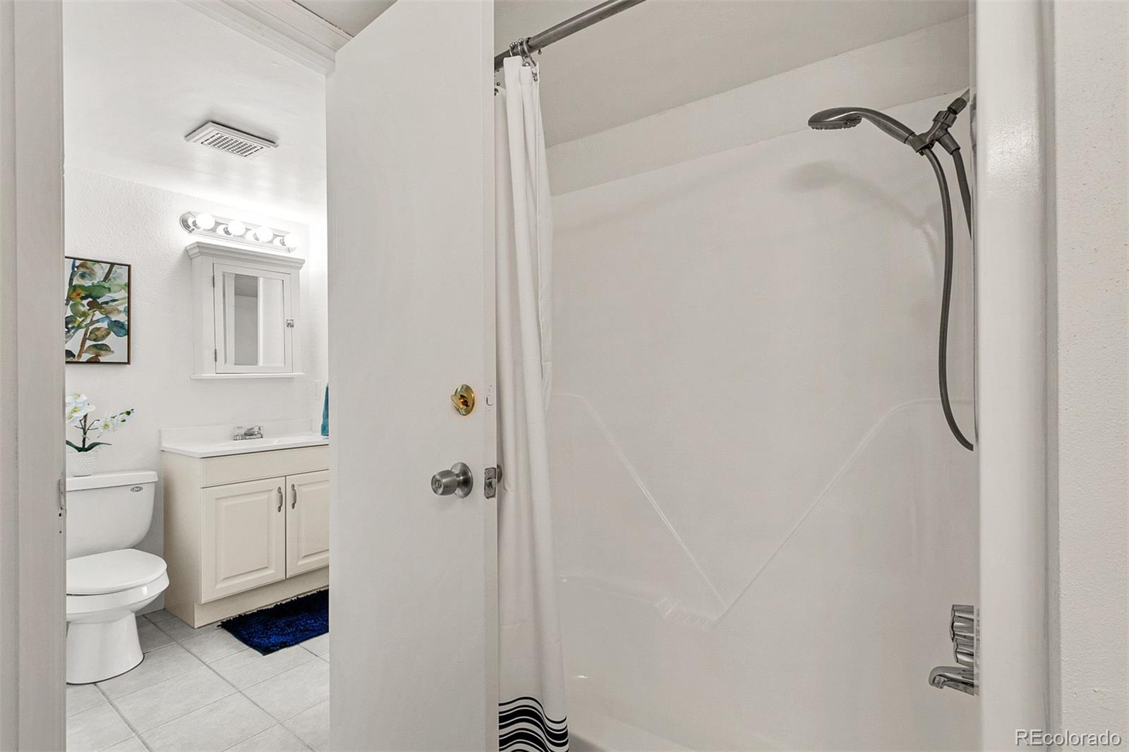 3250 Oneal Circle, Unit 17 Boulder, CO 80301 - Photo 21 of 29 a bathroom with a granite countertop shower toilet and sink
