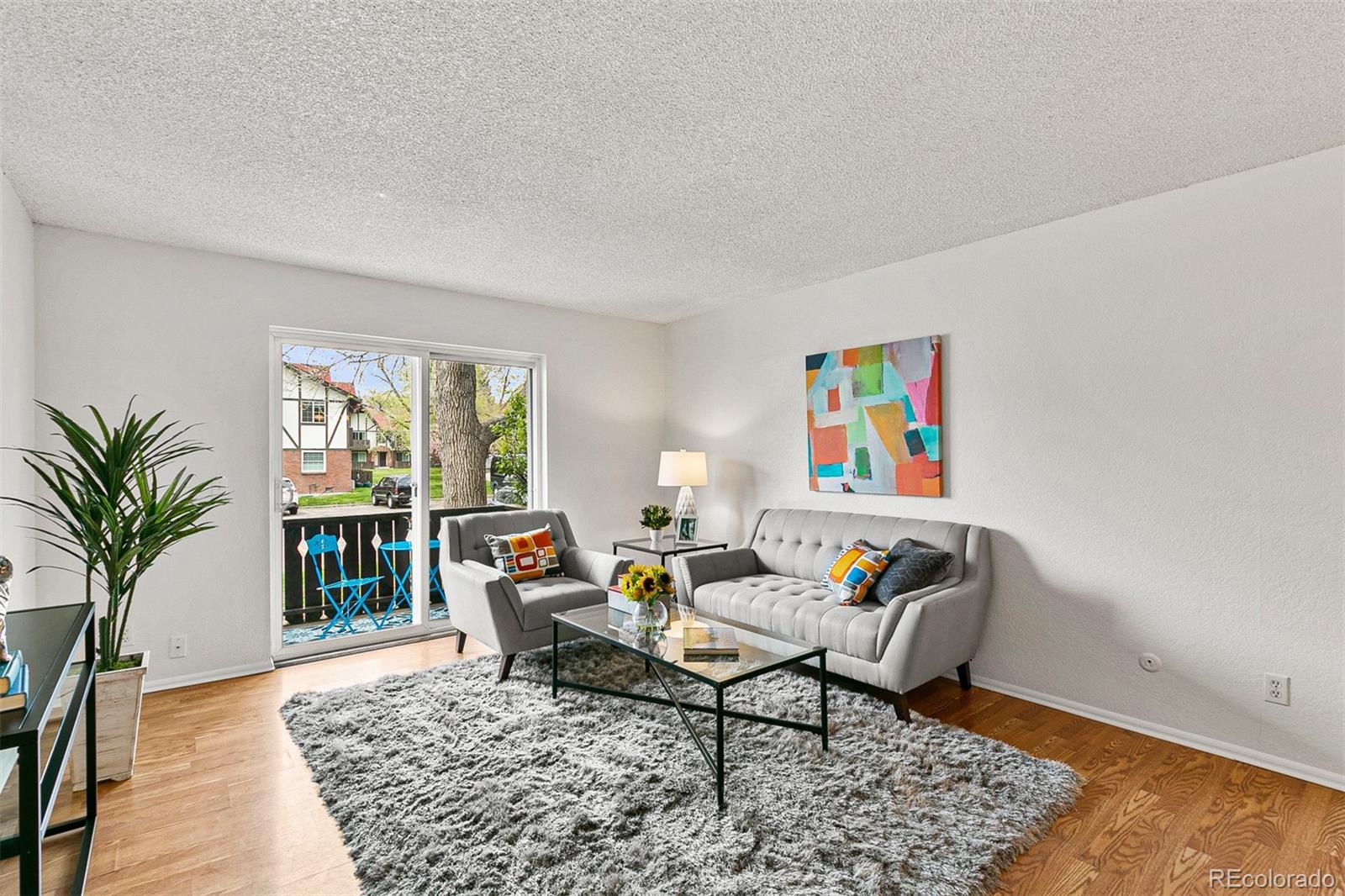 3250 Oneal Circle, Unit 17 Boulder, CO 80301 - Photo 4 of 29 a living room with furniture and a potted plant