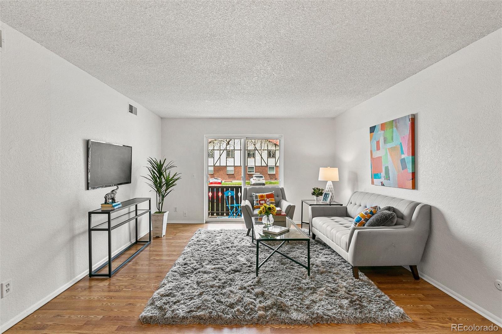 3250 Oneal Circle, Unit 17 Boulder, CO 80301 - Photo 5 of 29 a living room with furniture and a flat screen tv