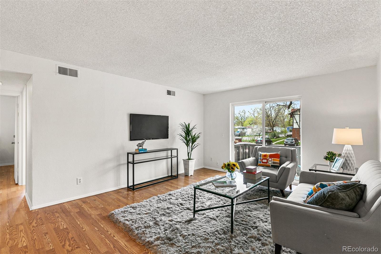 3250 Oneal Circle, Unit 17 Boulder, CO 80301 - Photo 6 of 29 a living room with furniture and a flat screen tv