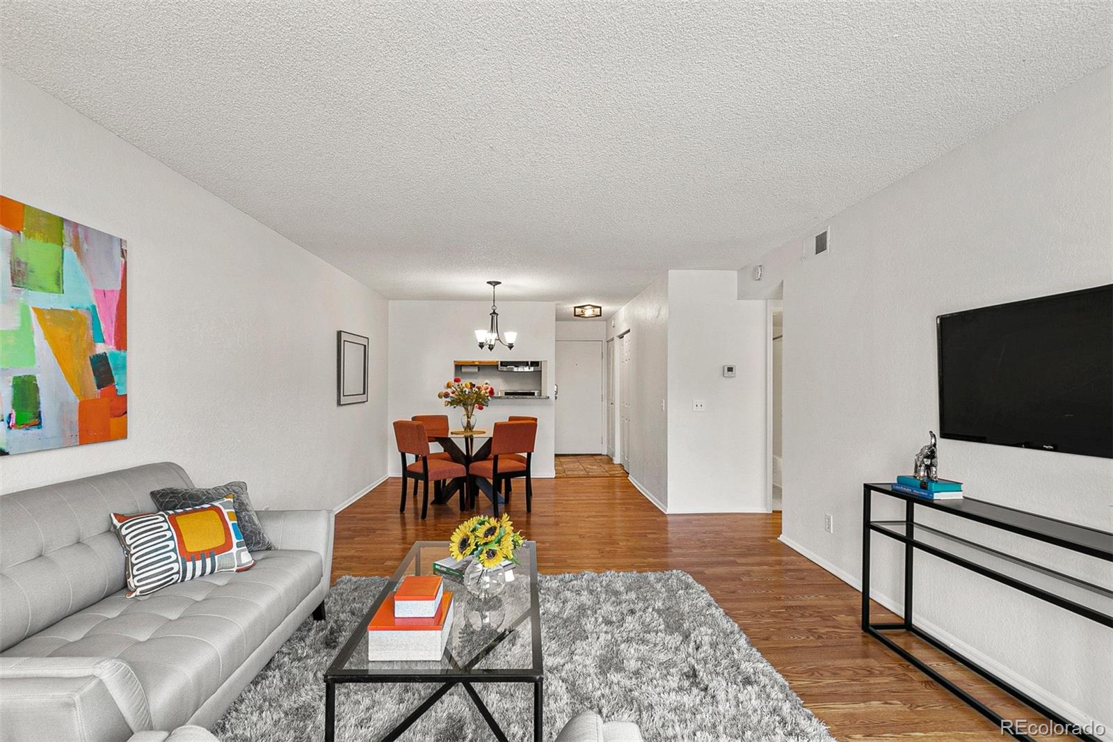 3250 Oneal Circle, Unit 17 Boulder, CO 80301 - Photo 7 of 29 a living room with furniture and a flat screen tv