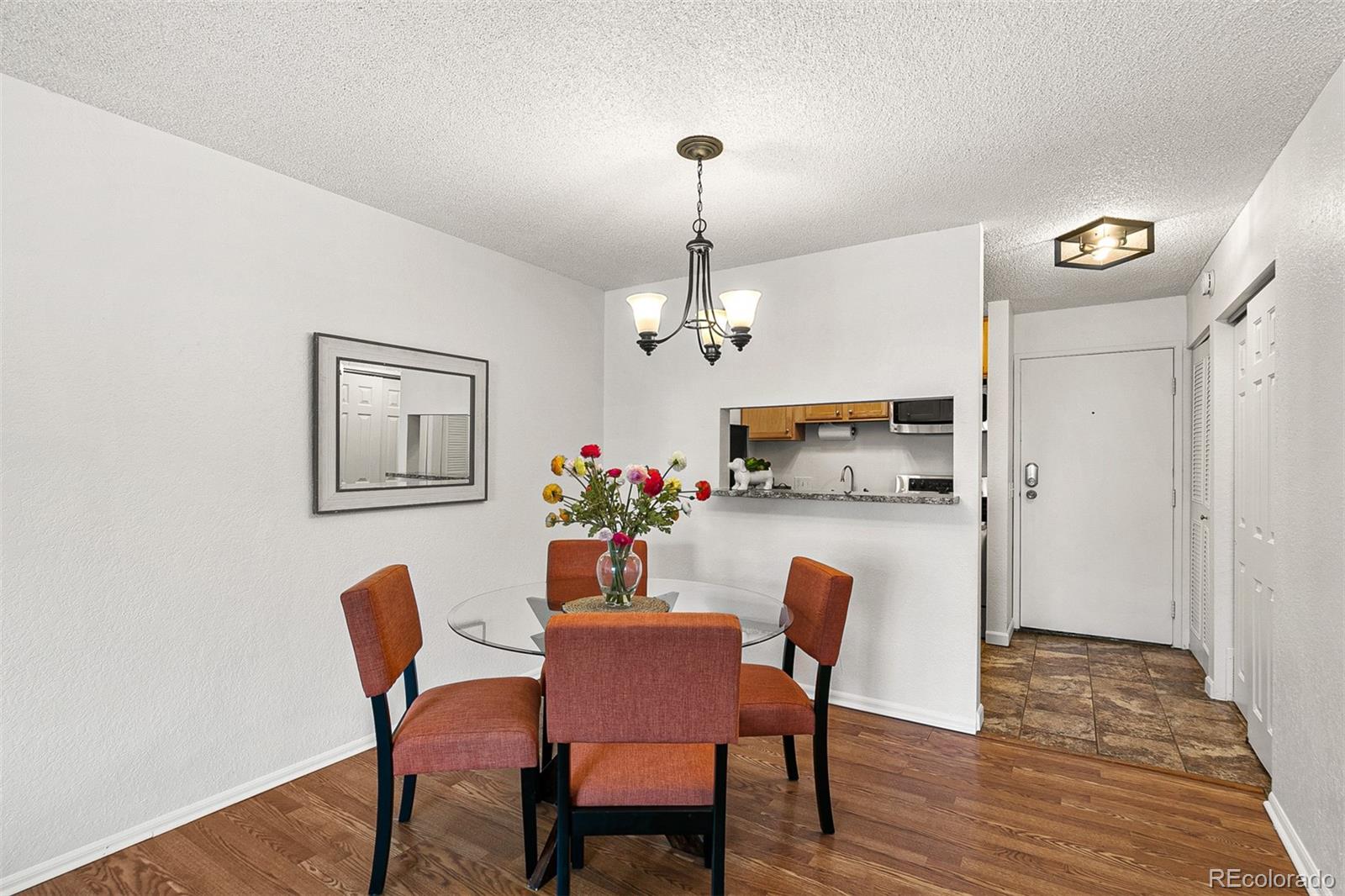 3250 Oneal Circle, Unit 17 Boulder, CO 80301 - Photo 9 of 29 a view of a dining room with furniture and wooden floor