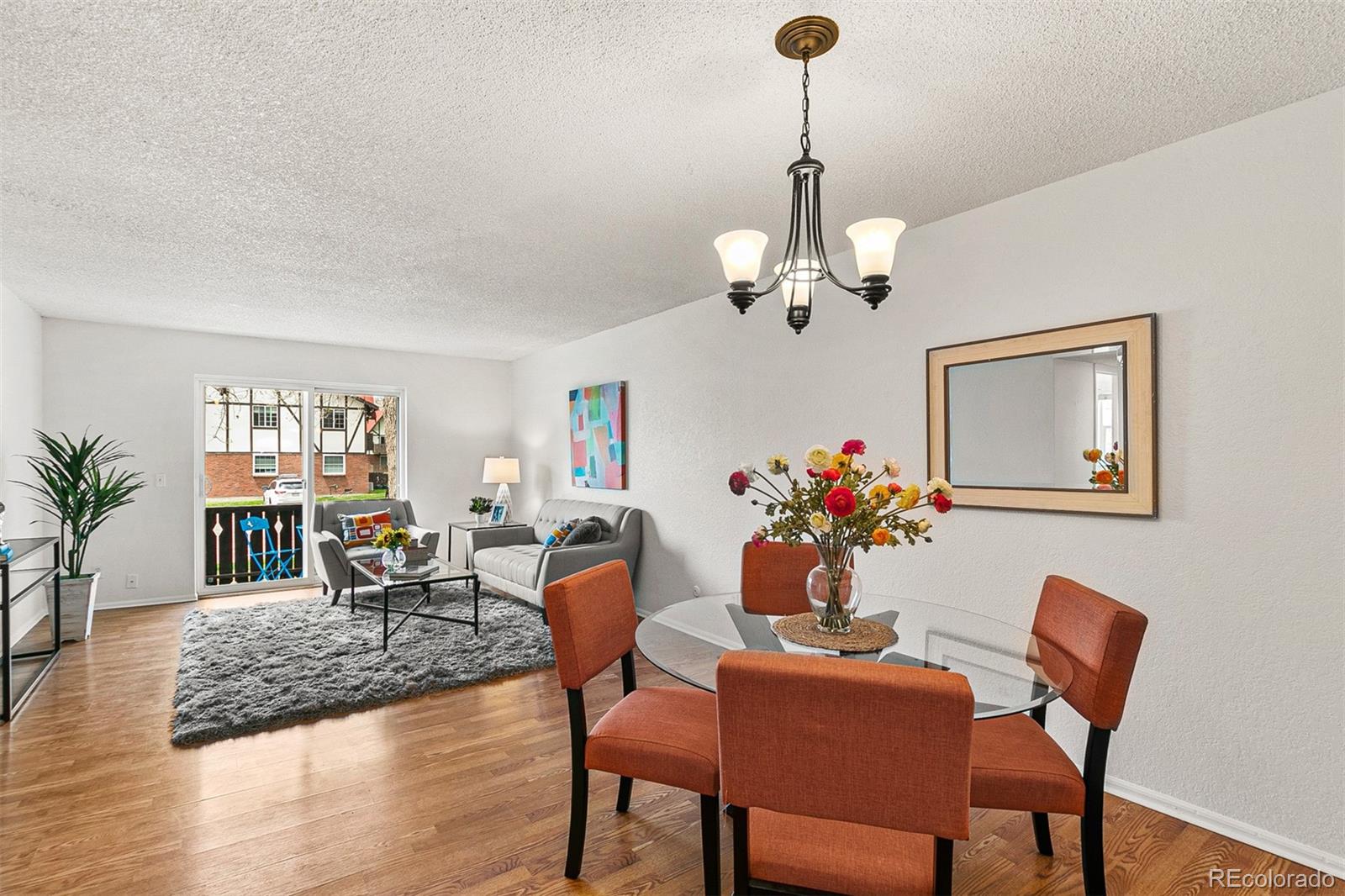 3250 Oneal Circle, Unit 17 Boulder, CO 80301 - Photo 10 of 29 a dining room with furniture potted plants and wooden floor