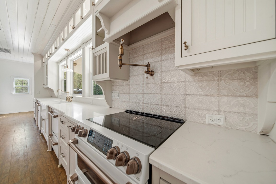 41712 Harpers Church Road Hempstead, TX 77445 - Photo 11 of 50 Top of line CAFE appliance's, pot filler, 2 dishwashers, bead board ceiling, vintage lighting, wood flooring, deep sink