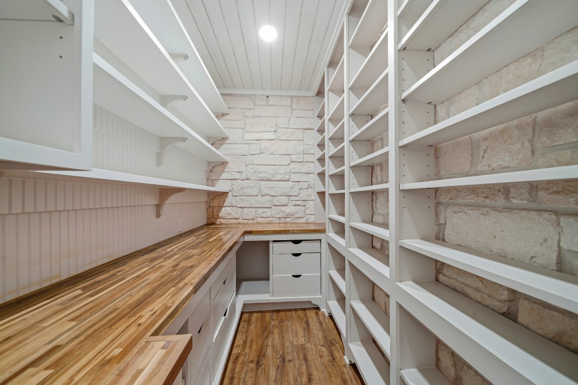 41712 Harpers Church Road Hempstead, TX 77445 - Photo 14 of 50 View of large walk in pantry in kitchen no. 2 with custom Wooden working space, canning and other/bulk storage, shelving and deep drawers, Austin Stone