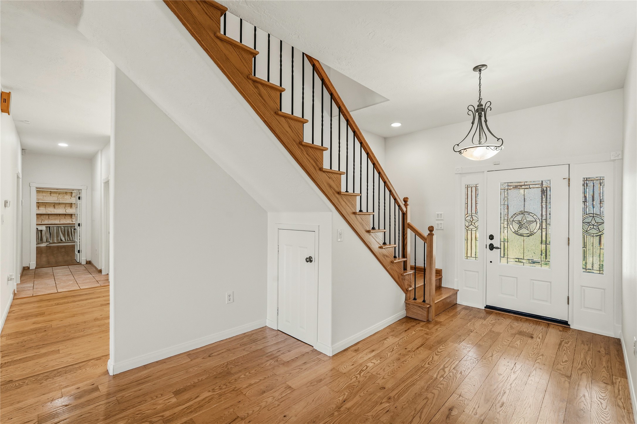 41712 Harpers Church Road Hempstead, TX 77445 - Photo 17 of 50 Entry Way, Wood flooring and one of two stairways leading up to Massive Entertainment and bedroom space, more storage under stairs