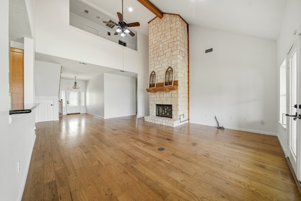 41712 Harpers Church Road Hempstead, TX 77445 - Photo 18 of 50 a view of empty room with wooden floor and fireplace