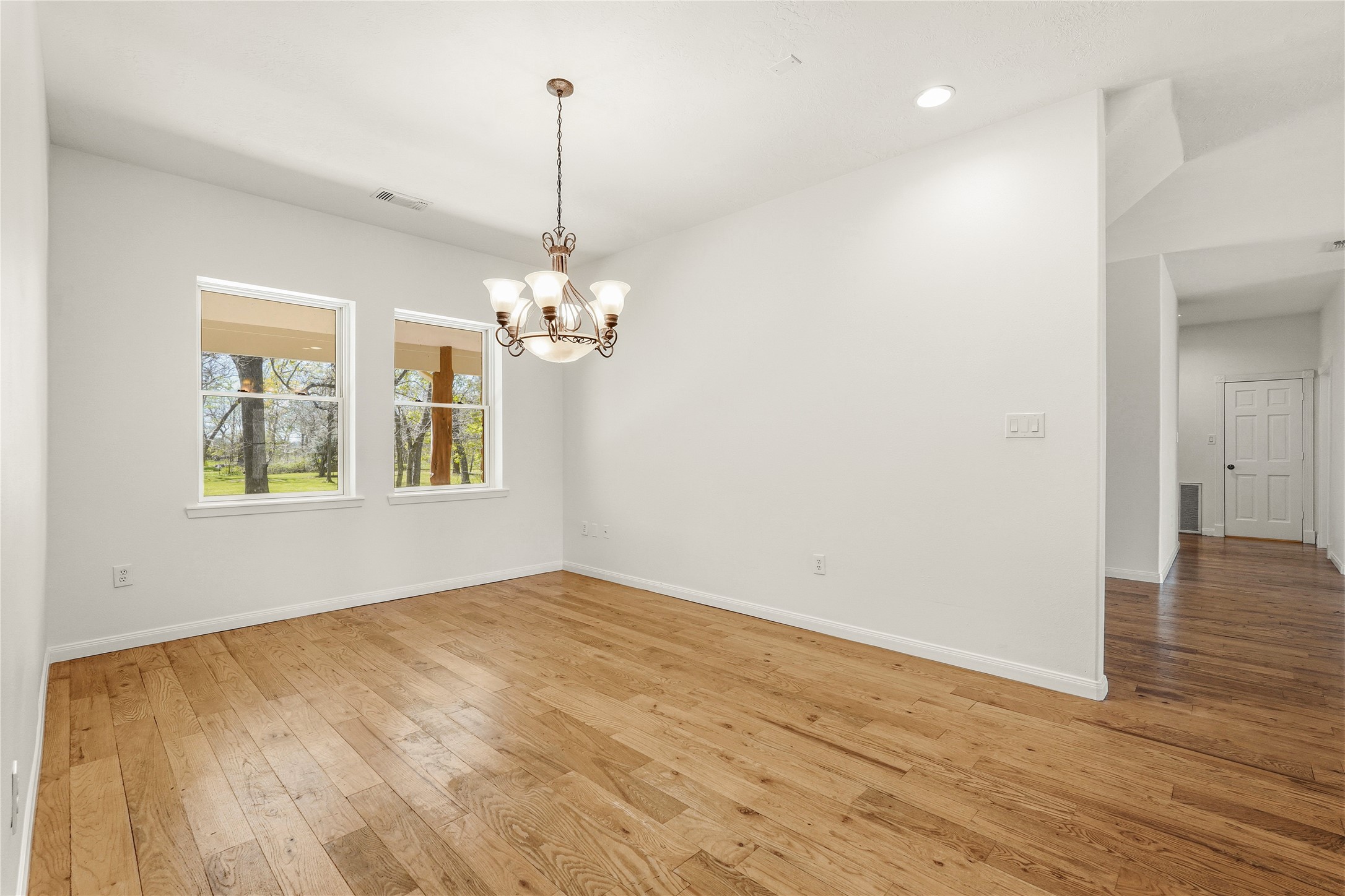 41712 Harpers Church Road Hempstead, TX 77445 - Photo 24 of 50 Formal Dining with views to front porch and trees, wood flooring