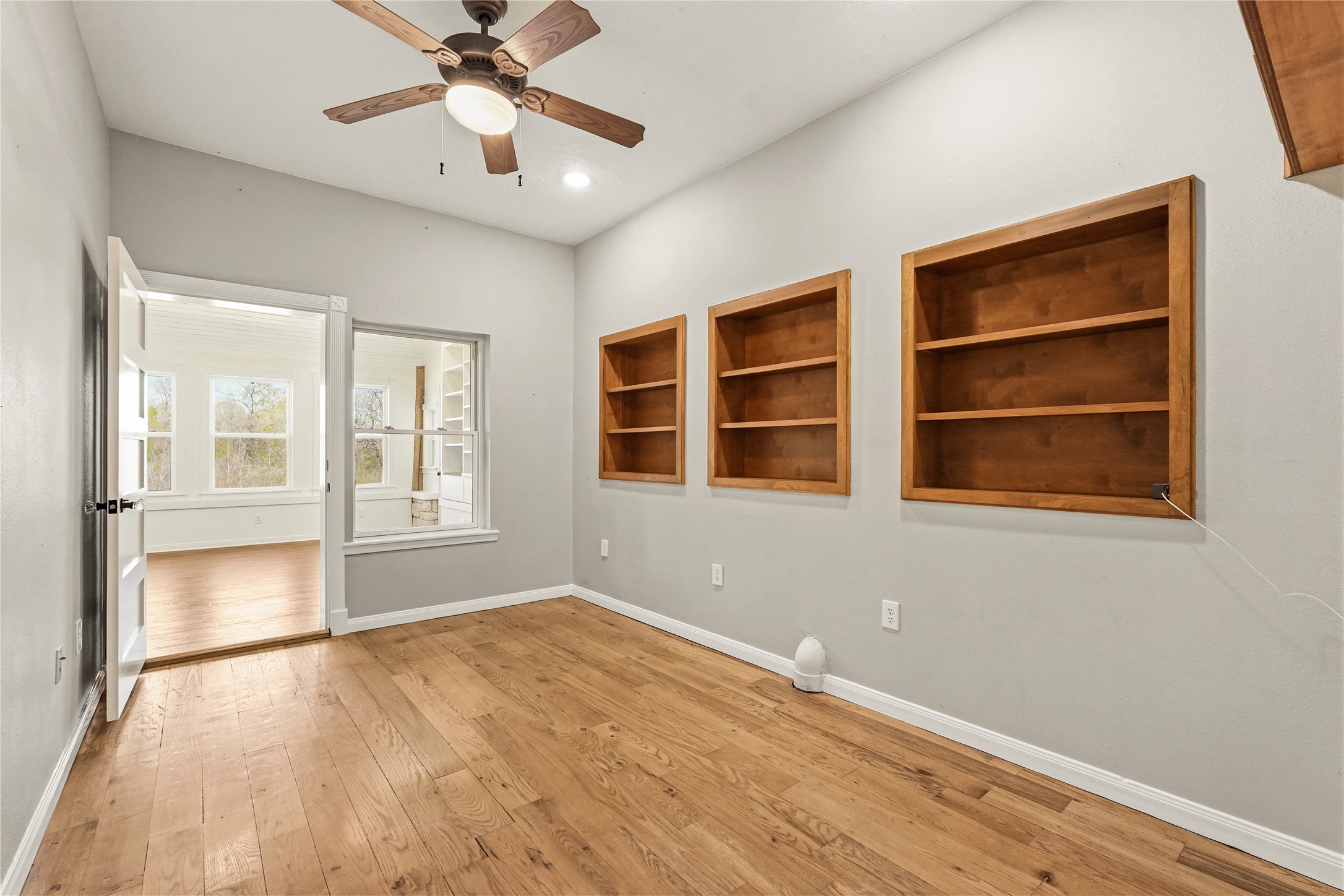 41712 Harpers Church Road Hempstead, TX 77445 - Photo 25 of 50 Office 1 w/built in bookcases, wood floors and Texas trim