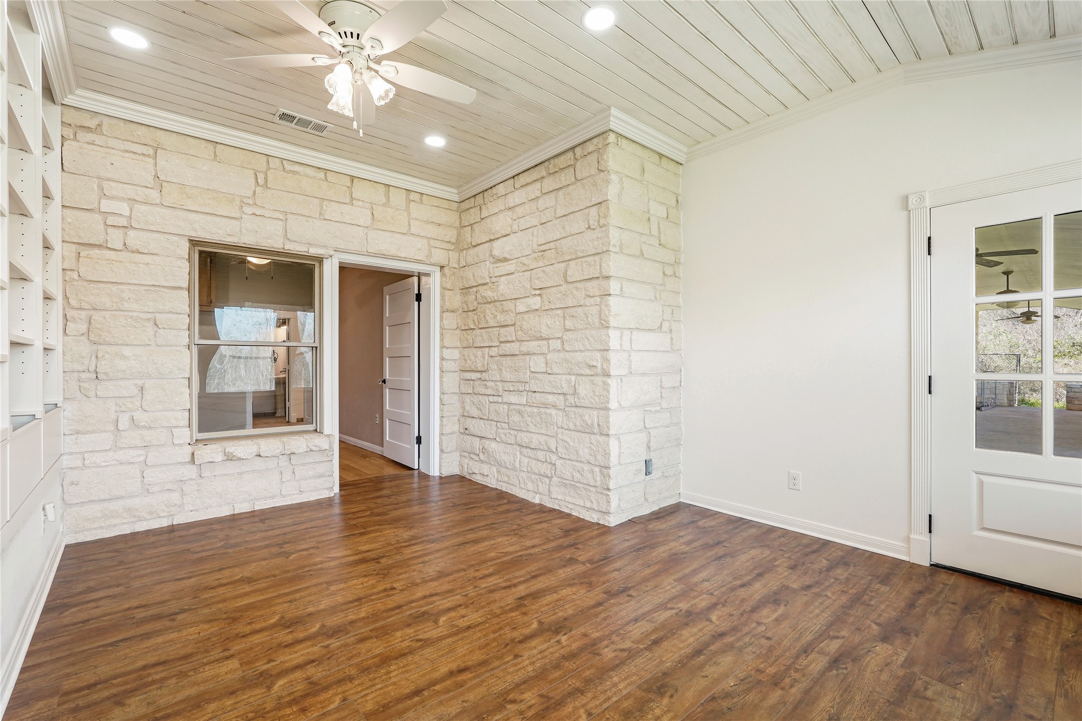 41712 Harpers Church Road Hempstead, TX 77445 - Photo 26 of 50 Office 2 w/views outside/natural light, built in bookshelves and storage, Austin stone, wood flooring,2 doors doors leading to backporch with Texas trim